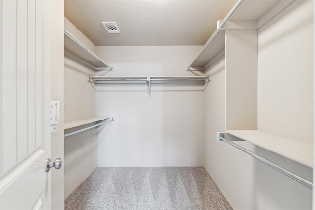 2718 Sharpish Way, Norman, OK 73069 - walk in closet featuring carpet floors