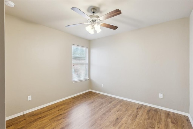 2718 Sharpish Way, Norman, OK 73069 - empty room with wood finished floors, ceiling fan, and a smoke detector