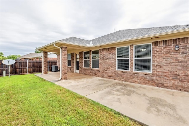 2718 Sharpish Way, Norman, OK 73069 - rear view of house featuring a shingled roof, a patio area, and brick siding