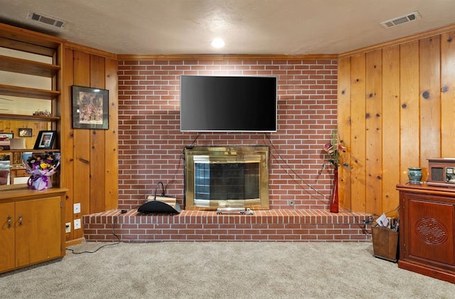3409 S 4th St, Chickasha, OK 73018 - carpeted living room with a fireplace and wood walls
