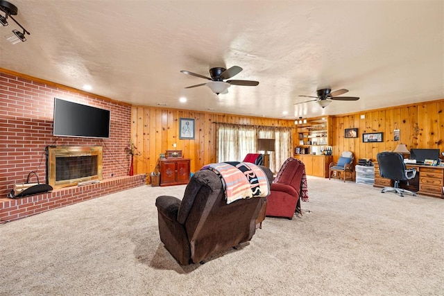 3409 S 4th St, Chickasha, OK 73018 - living room with carpet, a desk, ceiling fan, wood walls, and recessed lighting