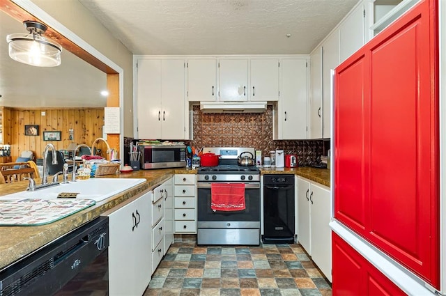 3409 S 4th St, Chickasha, OK 73018 - kitchen featuring appliances with stainless steel finishes, under cabinet range hood, tasteful backsplash, white cabinetry, and a textured ceiling