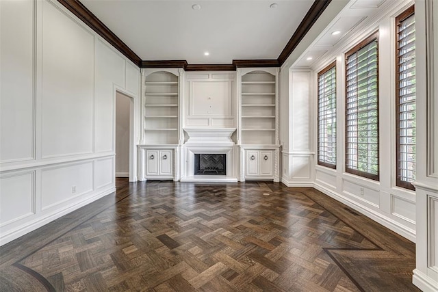 6516 NW Grand Blvd, Nichols Hills, OK 73116 - unfurnished living room with a decorative wall, a fireplace with raised hearth, ornamental molding, built in features, and recessed lighting