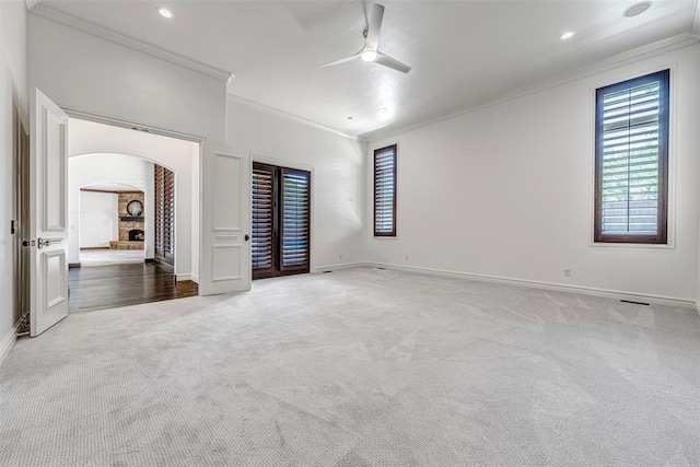 6516 NW Grand Blvd, Nichols Hills, OK 73116 - unfurnished bedroom featuring arched walkways, ornamental molding, carpet flooring, recessed lighting, and ceiling fan