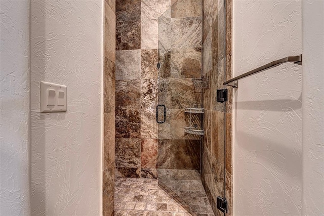 6516 NW Grand Blvd, Nichols Hills, OK 73116 - bathroom with a shower stall and a textured wall
