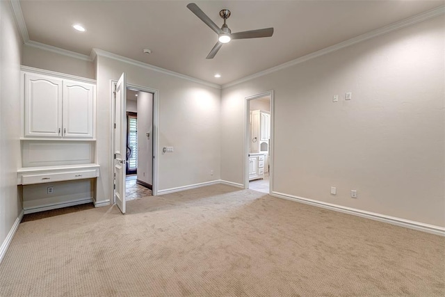 6516 NW Grand Blvd, Nichols Hills, OK 73116 - unfurnished bedroom featuring light colored carpet, crown molding, recessed lighting, connected bathroom, and a ceiling fan