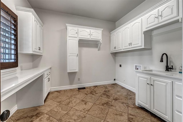 6516 NW Grand Blvd, Nichols Hills, OK 73116 - washroom featuring cabinet space, washer hookup, electric dryer hookup, and light stone finish flooring