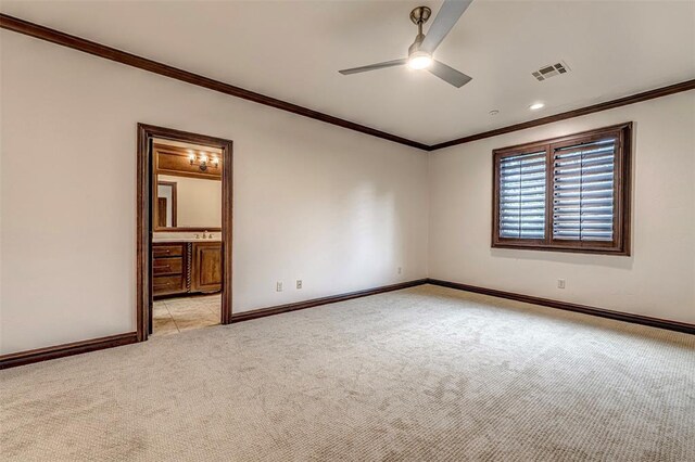6516 NW Grand Blvd, Nichols Hills, OK 73116 - empty room with light colored carpet, crown molding, and a ceiling fan