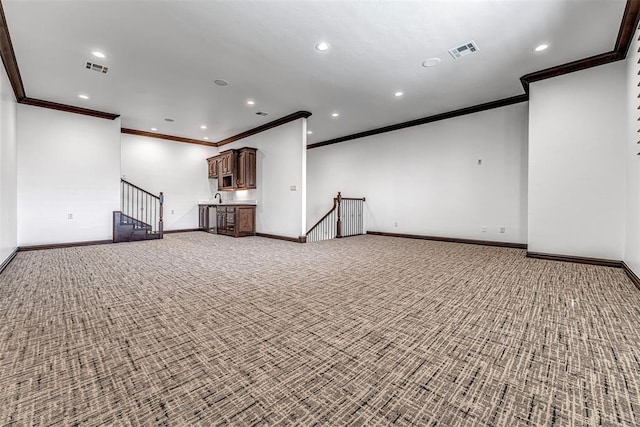 6516 NW Grand Blvd, Nichols Hills, OK 73116 - unfurnished living room featuring crown molding, carpet flooring, recessed lighting, and stairs