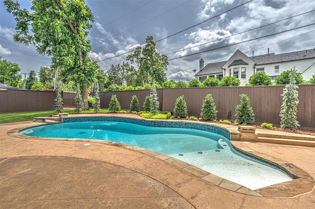 6516 NW Grand Blvd, Nichols Hills, OK 73116 - view of swimming pool featuring a fenced backyard and a patio