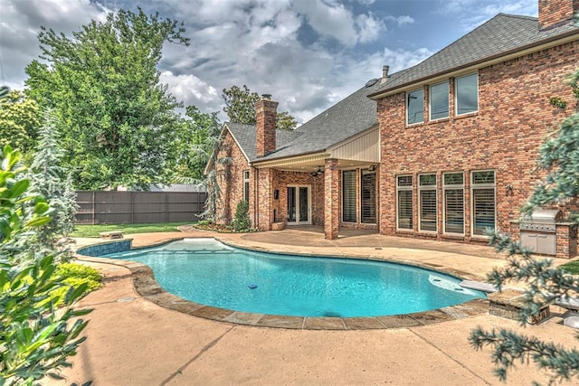 6516 NW Grand Blvd, Nichols Hills, OK 73116 - view of pool featuring a patio and exterior kitchen