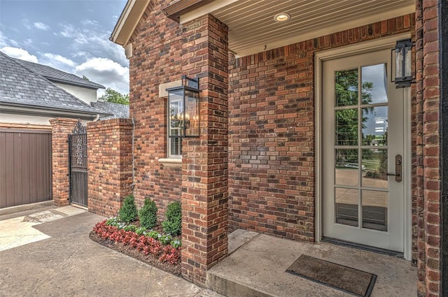 6516 NW Grand Blvd, Nichols Hills, OK 73116 - view of exterior entry with brick siding