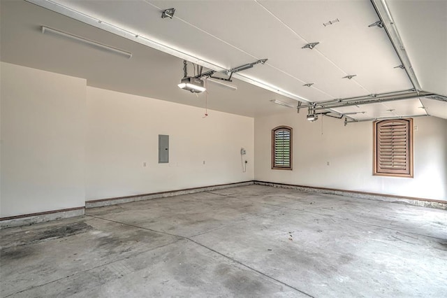 6516 NW Grand Blvd, Nichols Hills, OK 73116 - garage featuring a garage door opener and electric panel