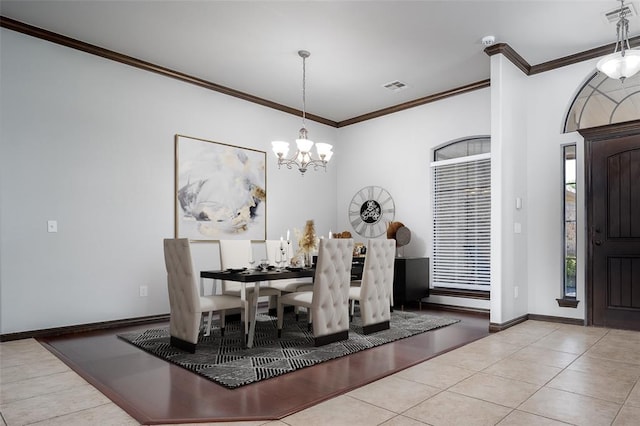 16312 Old Elm Ln, Edmond, OK 73013 - tiled dining area with ornamental molding and a chandelier