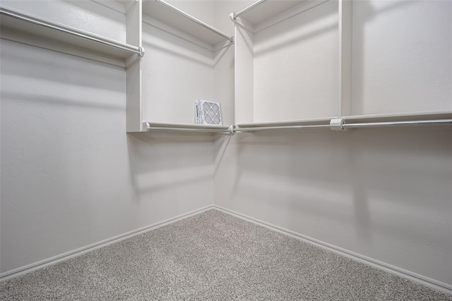 16312 Old Elm Ln, Edmond, OK 73013 - spacious closet with carpet floors