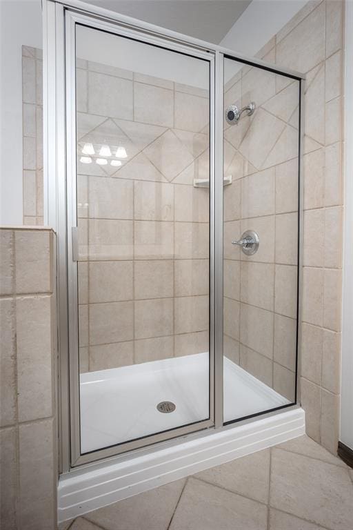 16312 Old Elm Ln, Edmond, OK 73013 - bathroom featuring a stall shower and tile patterned floors