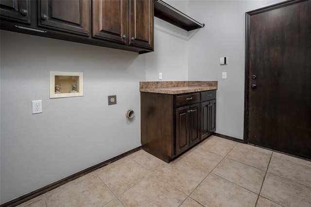 16312 Old Elm Ln, Edmond, OK 73013 - laundry area with cabinet space, washer hookup, hookup for an electric dryer, and light tile patterned floors