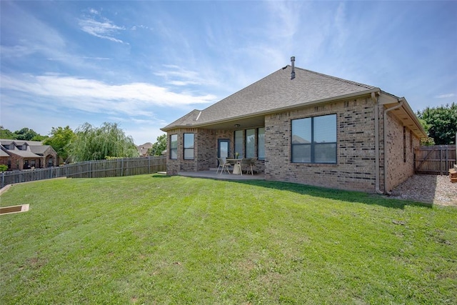 16312 Old Elm Ln, Edmond, OK 73013 - rear view of property with brick siding, a fenced backyard, a patio area, and a shingled roof