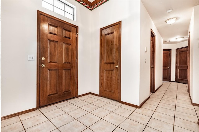 11129 Springhollow Ct, Oklahoma City, OK 73120 - entrance foyer featuring light tile patterned flooring and baseboards