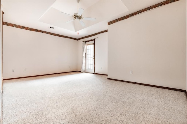 11129 Springhollow Ct, Oklahoma City, OK 73120 - spare room with ceiling fan and a tray ceiling