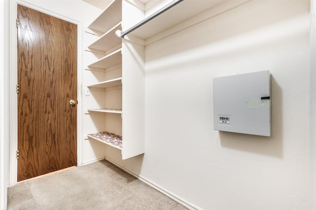 11129 Springhollow Ct, Oklahoma City, OK 73120 - walk in closet featuring carpet flooring