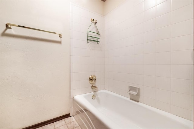 11129 Springhollow Ct, Oklahoma City, OK 73120 - bathroom with tub / shower combination and baseboards