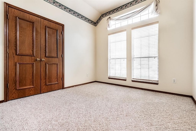 11129 Springhollow Ct, Oklahoma City, OK 73120 - spare room featuring carpet floors and lofted ceiling