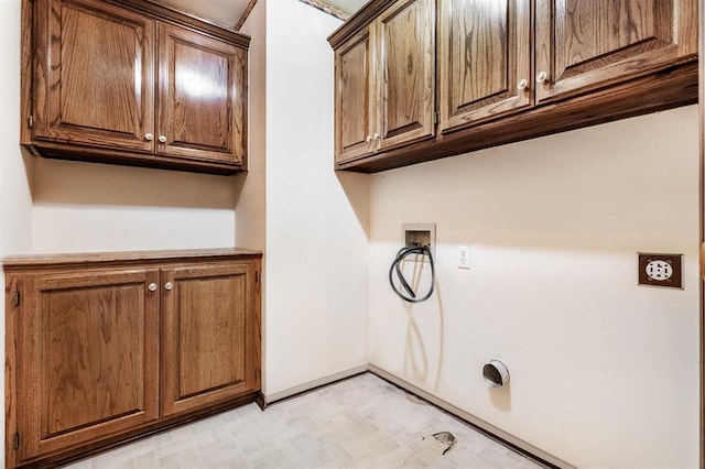 11129 Springhollow Ct, Oklahoma City, OK 73120 - laundry room with cabinet space, washer hookup, hookup for an electric dryer, and light floors