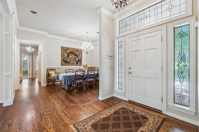108 N Bradbury Dr, Edmond, OK 73034 - entryway with a chandelier, wood finished floors, and ornamental molding