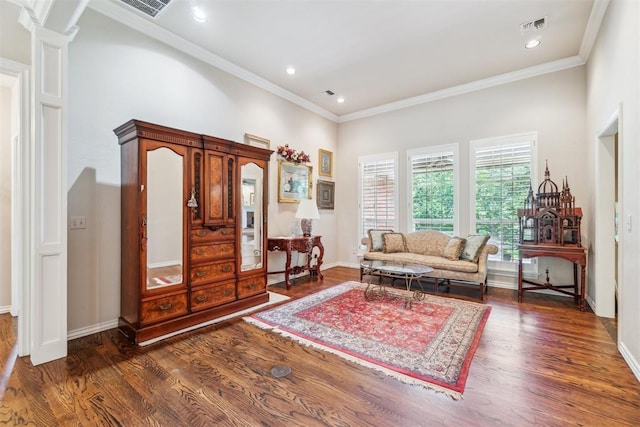 108 N Bradbury Dr, Edmond, OK 73034 - living area featuring wood finished floors, ornamental molding, and recessed lighting