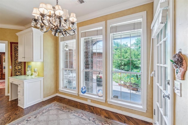 108 N Bradbury Dr, Edmond, OK 73034 - unfurnished dining area featuring dark wood-style floors, a chandelier, and ornamental molding