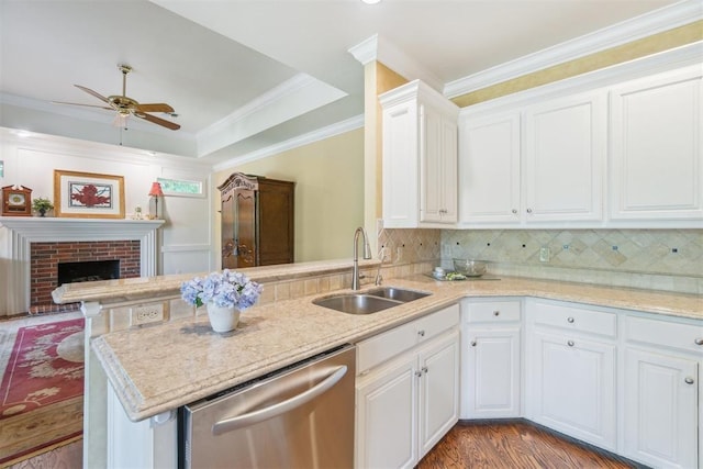 108 N Bradbury Dr, Edmond, OK 73034 - kitchen featuring dishwasher, a peninsula, ceiling fan, white cabinets, and ornamental molding