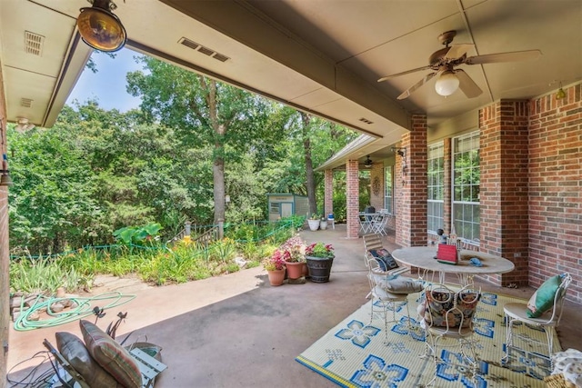108 N Bradbury Dr, Edmond, OK 73034 - view of patio with a shed, a ceiling fan, and outdoor dining area