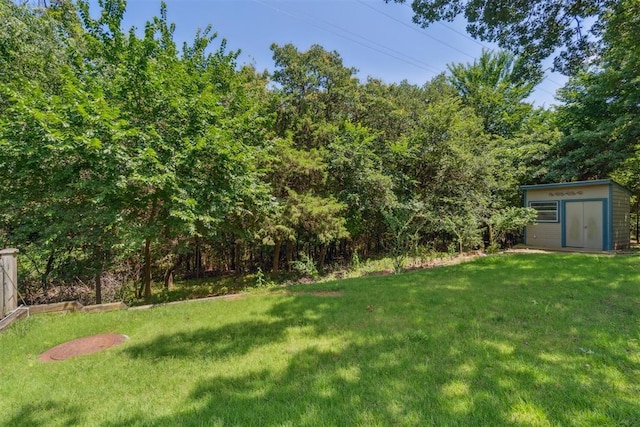 108 N Bradbury Dr, Edmond, OK 73034 - view of green lawn with a storage unit