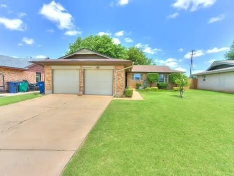 1329 SW 77th Ter, Oklahoma City, OK 73159 - ranch-style home featuring an attached garage, driveway, a front yard, and brick siding