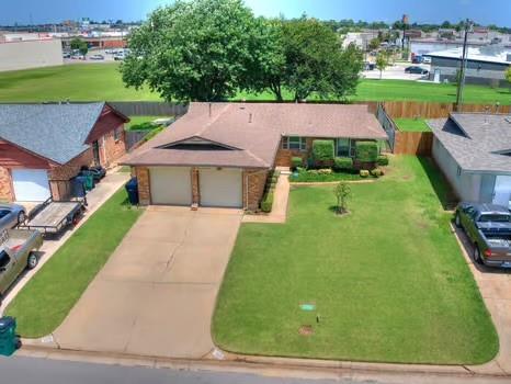 1329 SW 77th Ter, Oklahoma City, OK 73159 - view of front of home featuring concrete driveway and a front yard