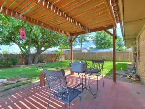 1329 SW 77th Ter, Oklahoma City, OK 73159 - fenced backyard with a patio area and outdoor dining space