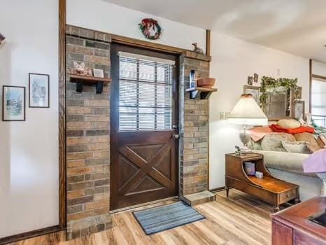 1329 SW 77th Ter, Oklahoma City, OK 73159 - doorway with wood finished floors