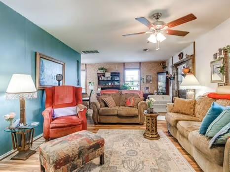 1329 SW 77th Ter, Oklahoma City, OK 73159 - living room featuring ceiling fan and wood finished floors