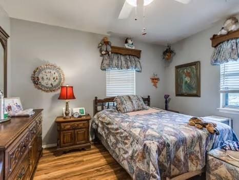 1329 SW 77th Ter, Oklahoma City, OK 73159 - bedroom with light wood-type flooring and a ceiling fan