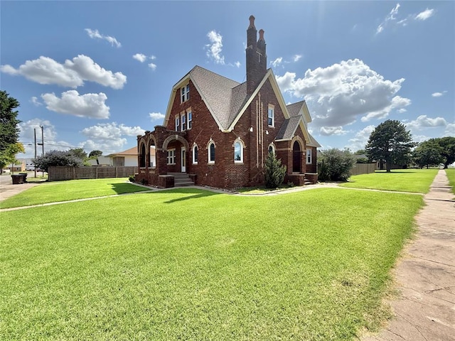 722 E Main St, Sentinel, OK 73664 - view of home's exterior featuring brick siding, a shingled roof, and a chimney