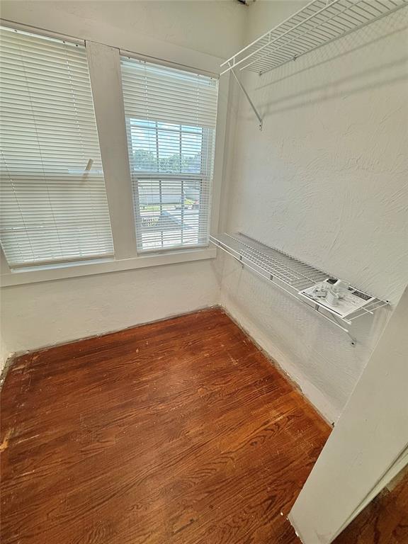722 E Main St, Sentinel, OK 73664 - spacious closet with wood finished floors