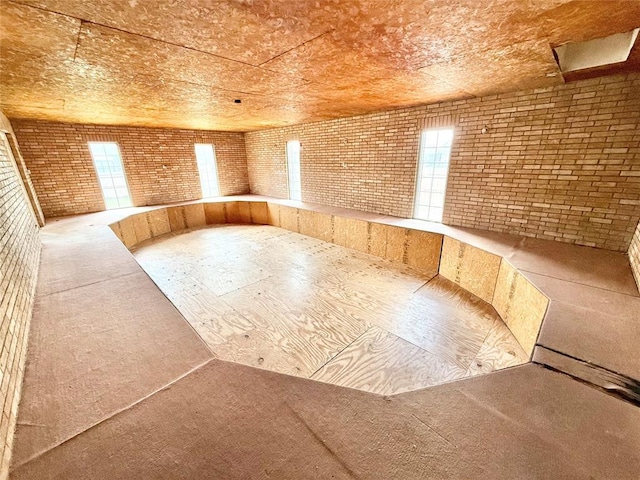722 E Main St, Sentinel, OK 73664 - spare room with brick wall