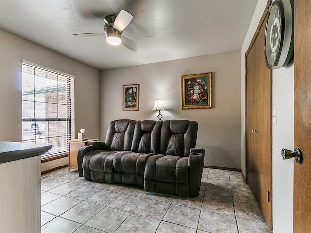 2228 Butternut Pl, Edmond, OK 73013 - living area featuring a ceiling fan and light tile patterned floors