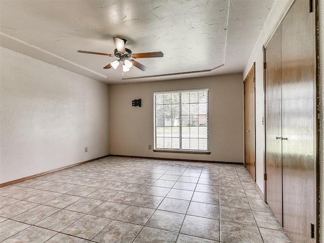 2228 Butternut Pl, Edmond, OK 73013 - spare room featuring ceiling fan and light tile patterned flooring