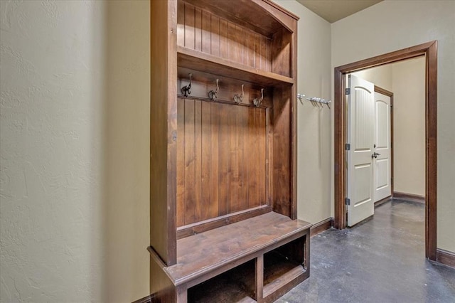 13705 Verona Strada, Oklahoma City, OK 73170 - mudroom with finished concrete floors and a textured wall