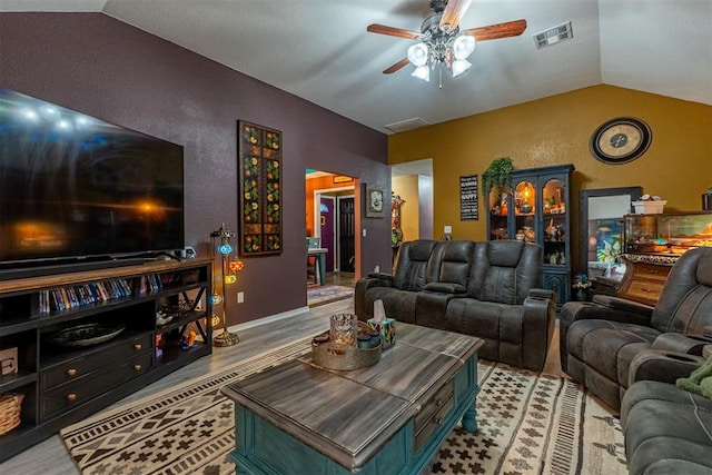 1408 Eagle Dr, Moore, OK 73160 - living room with vaulted ceiling, ceiling fan, and wood finished floors