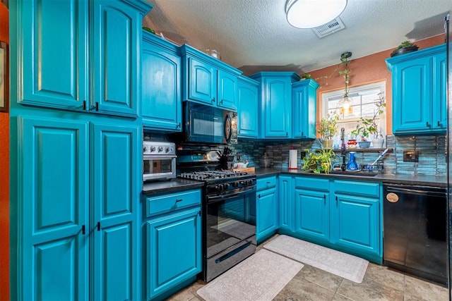 1408 Eagle Dr, Moore, OK 73160 - kitchen with black appliances, dark countertops, backsplash, a textured ceiling, and decorative light fixtures