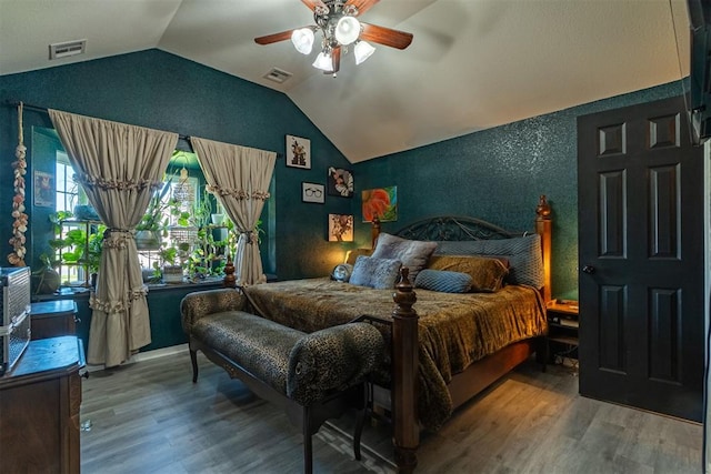 1408 Eagle Dr, Moore, OK 73160 - bedroom featuring vaulted ceiling, wood finished floors, a textured wall, and a ceiling fan