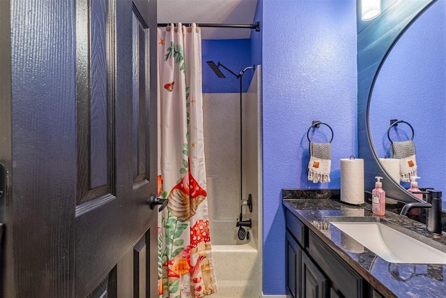 1408 Eagle Dr, Moore, OK 73160 - bathroom with a textured wall, vanity, and shower / bath combo